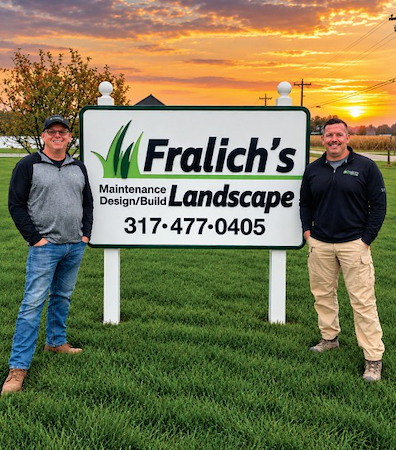 Aaron Fralich and Brent Rouse standing beside the Fralich's Landscape sign